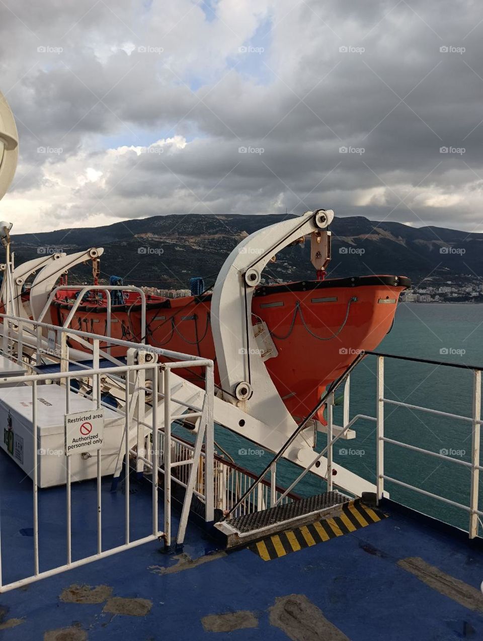 Sea adventure on a boat with a view of the mountains and boats