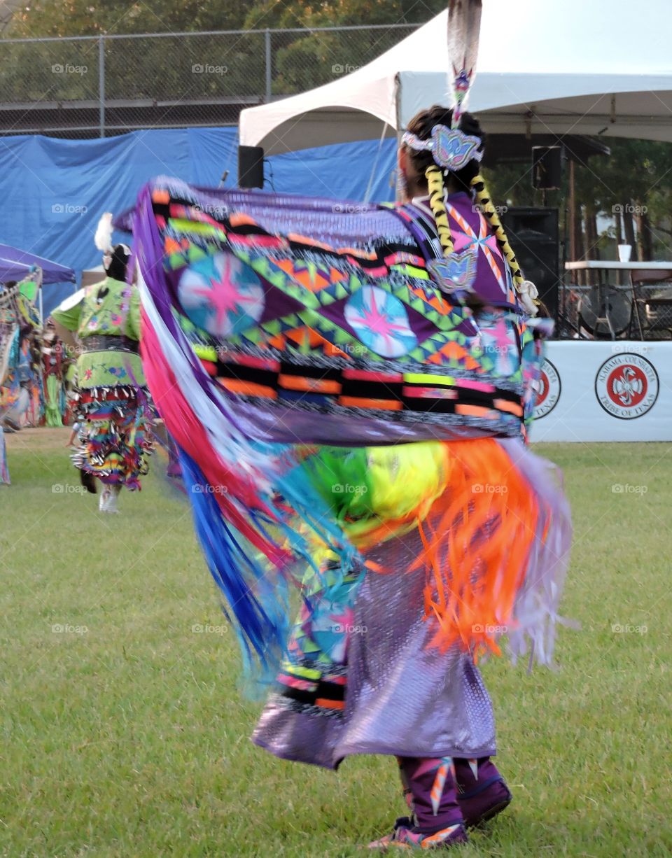 INDIAN WOMAN DANCING AT POW WOW 