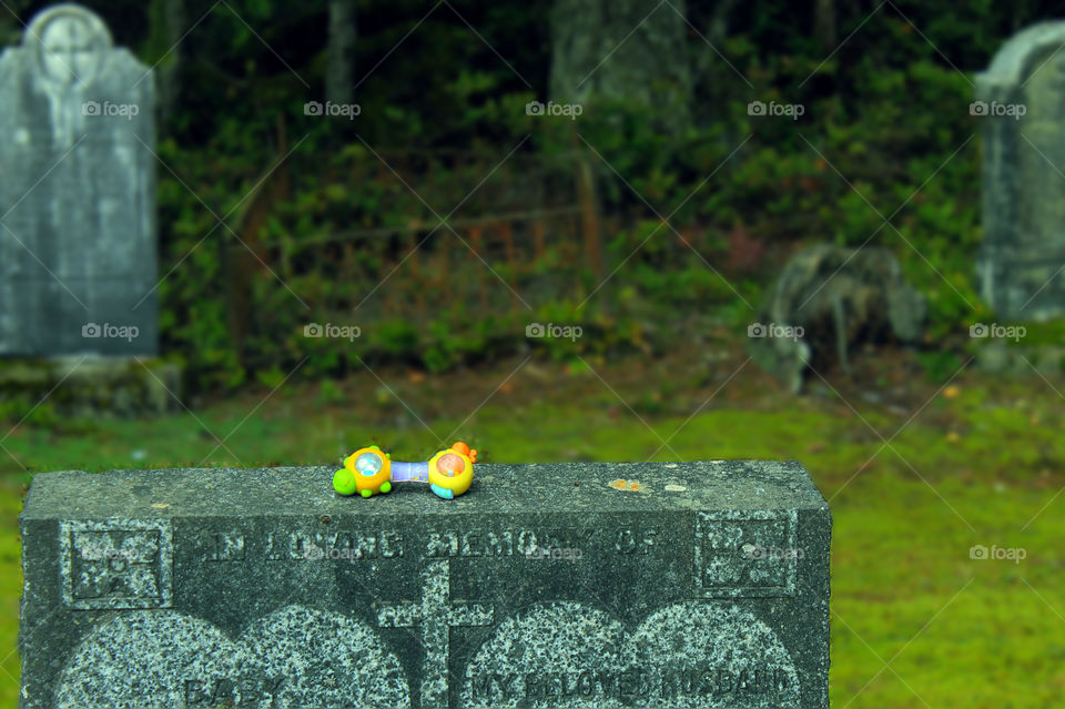 Have been respectfully visiting some cemeteries to take some pictures as they can be quite poignant & the stories move me. This was a double grave marker for an infant & husband. It was quite old but someone still visits to leave a toy for the baby. 