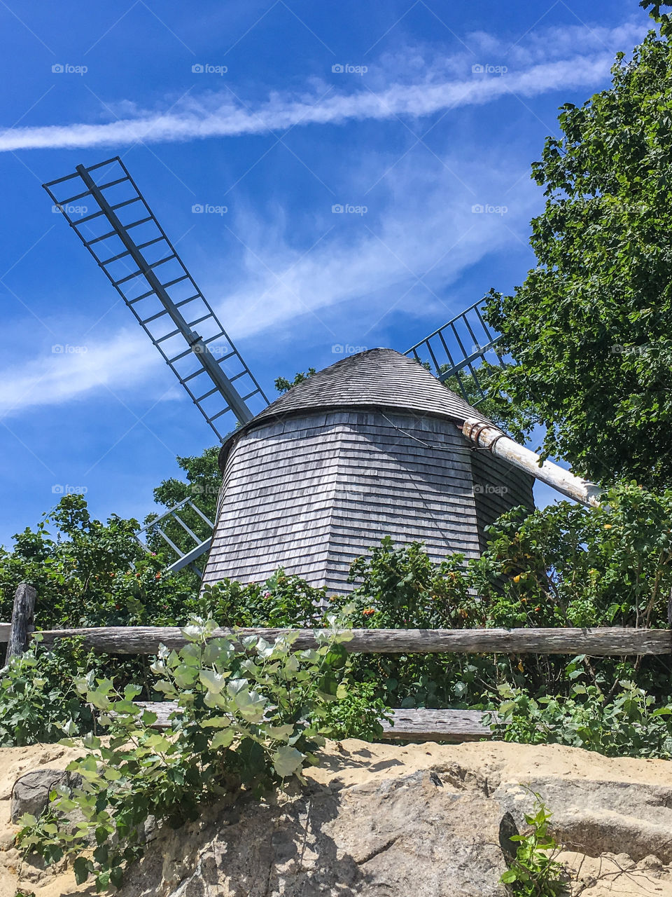 I choose the countryside!  Where else would you find an antique grist/windmill?  