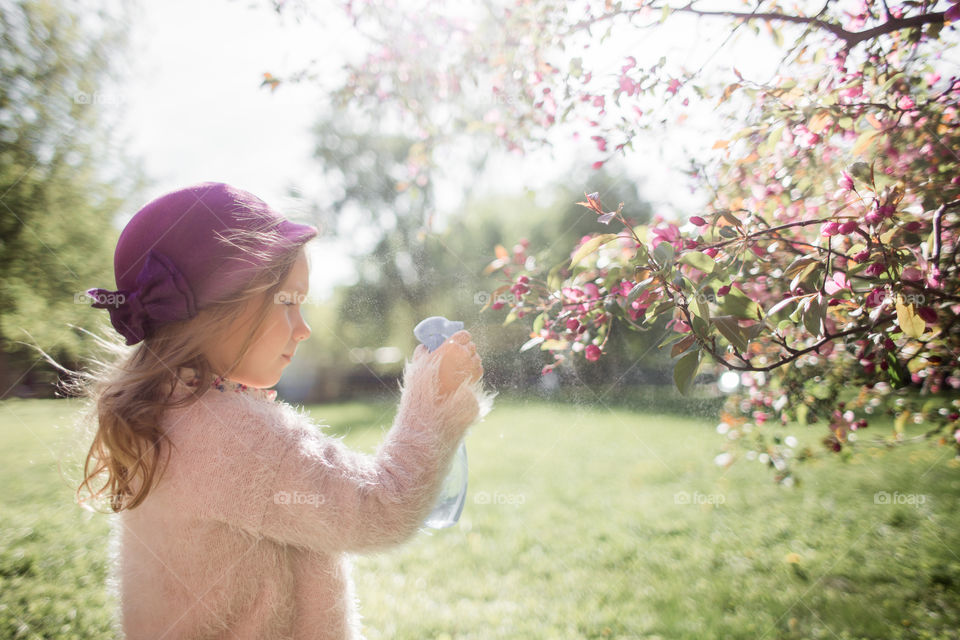 Cute Little girl in a blossom park