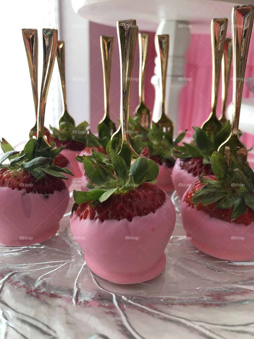 Strawberries dipped in pink tinted white chocolate 