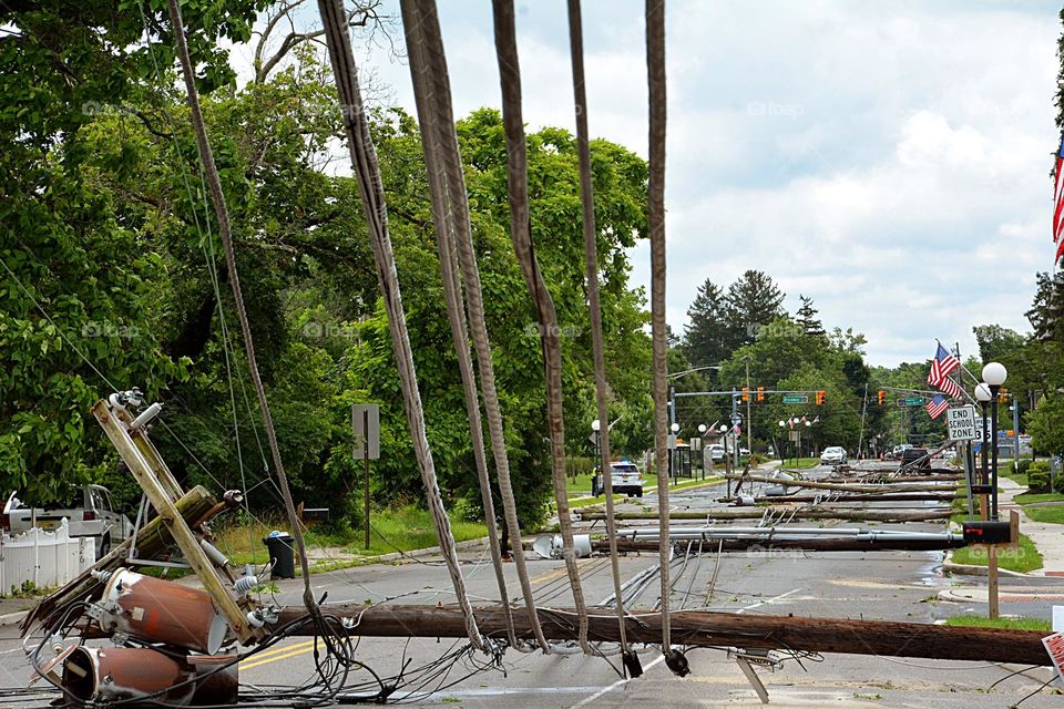 Downed power lines are seen in the middle of the street after a severe wind storm