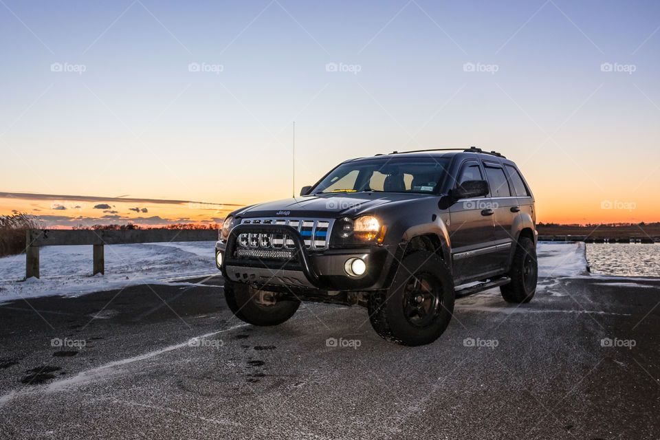 Jeep Grand Cherokee at Sunset with Cop blue line