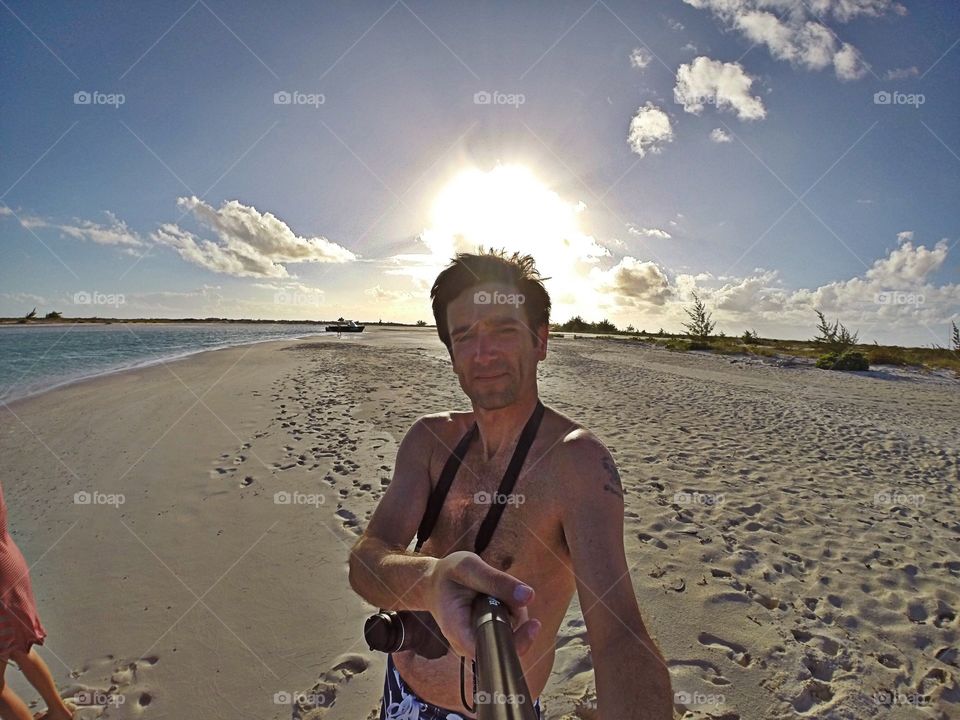 Me with the sun setting behind me in the Turks & Caicos Islands