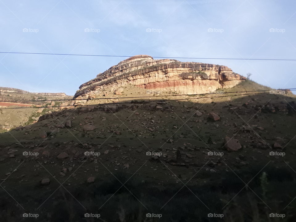 The sunsets over a beautiful mountain.