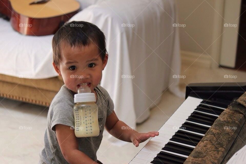 Baby learning the piano