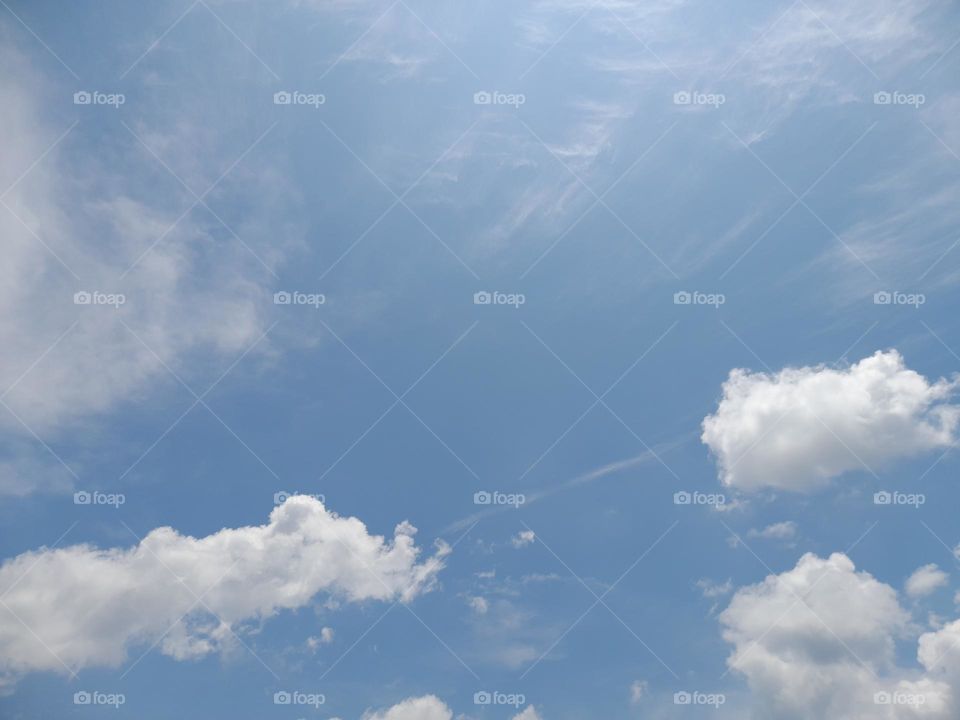 White clouds with blue sky background