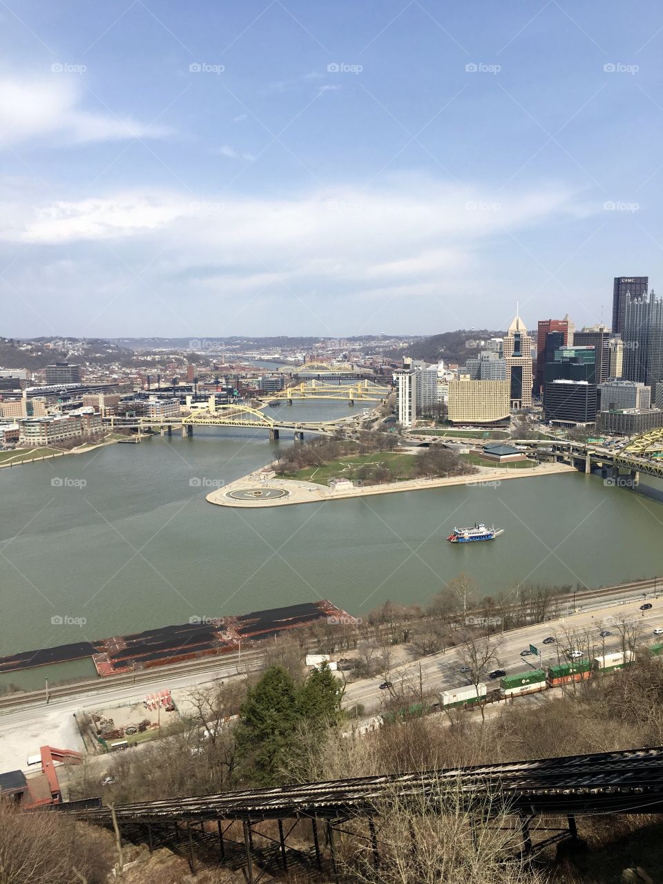 Pittsburgh landscape with ferry. Bridge. Pittsburgh skyline. Train. Harbor. Scenic. 