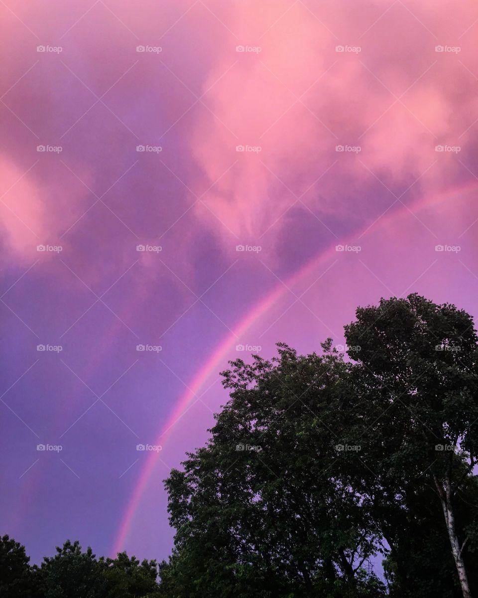 Purple sky with rainbow