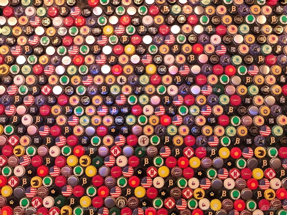 Bottle caps in wall 