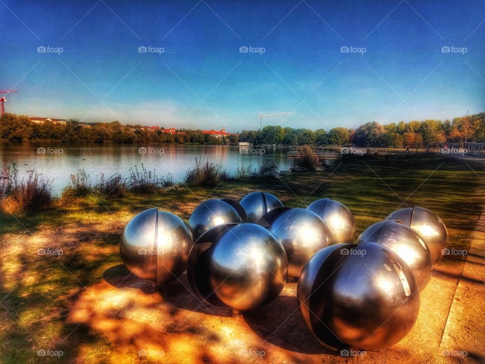 Metal Spheres at a lake