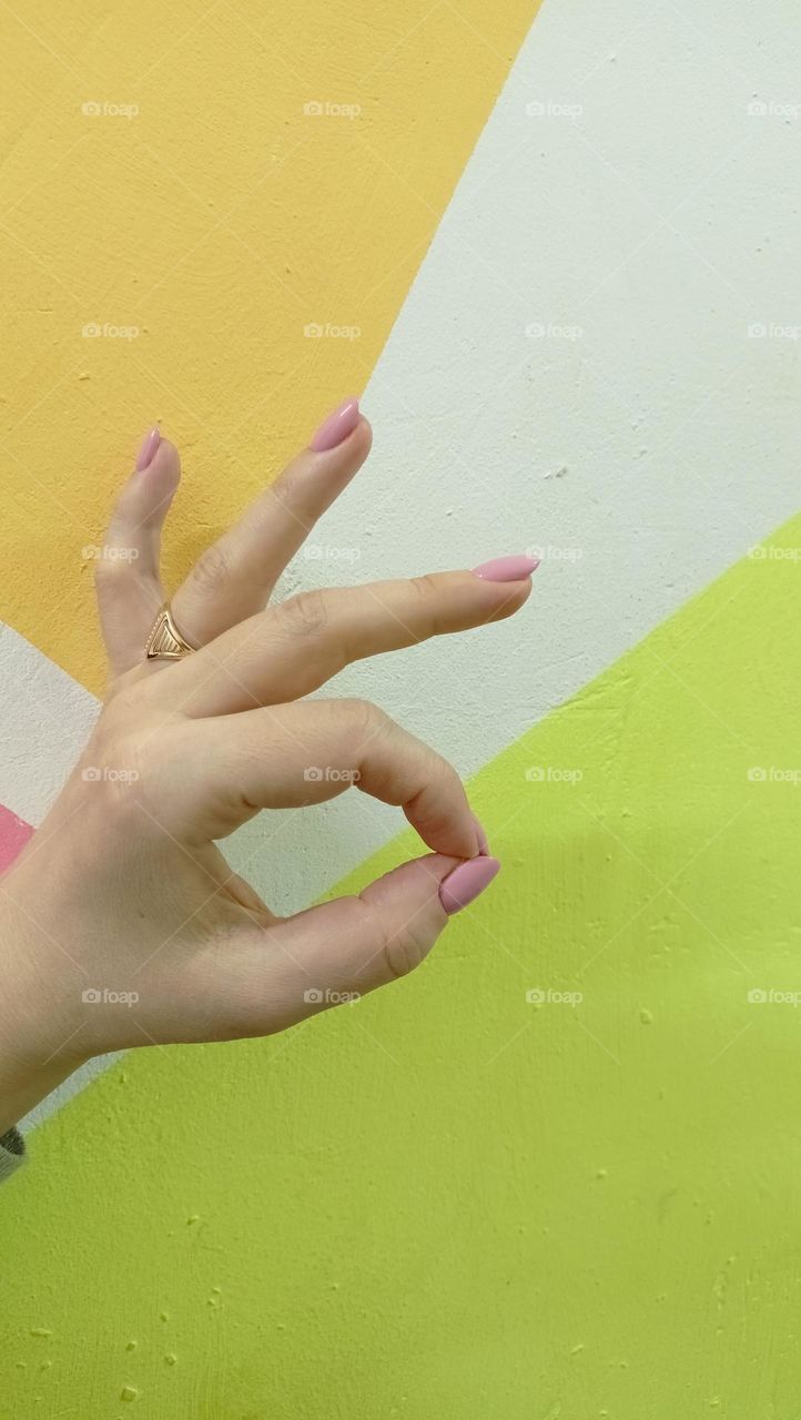 bright colors, explosion of color, delta and orange, woman's hand, pink manicure