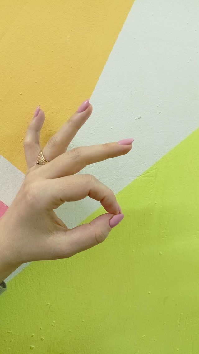 bright colors, explosion of color, delta and orange, woman's hand, pink manicure