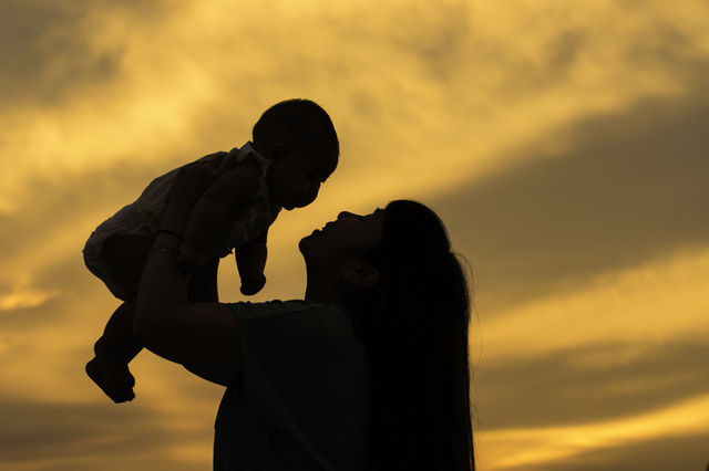 The moment of true love.. Mama and her baby are playing together with
 the good mood when the sun set.