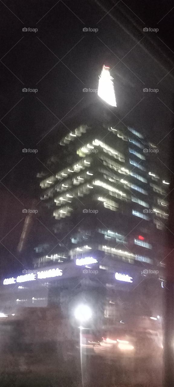 Twinkling windows , the beauty of evening light. Bask in the beauty of evening light with the view of light twinkling from these windows at night