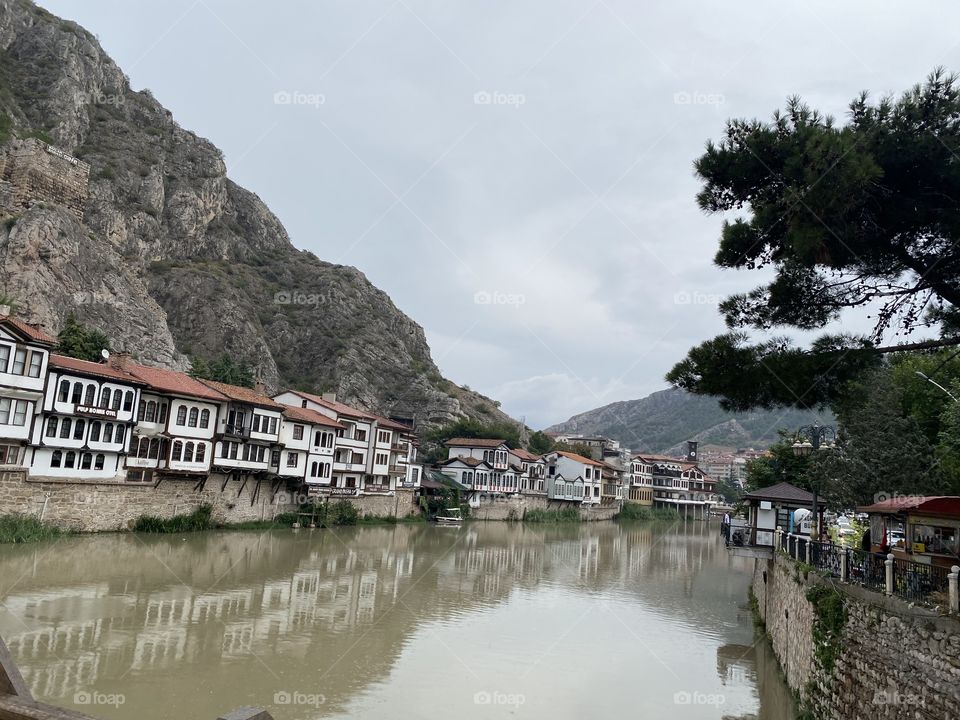 Old city, old houses and a green river