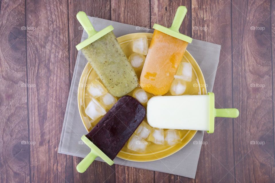 four types of homemade fruit popsicles