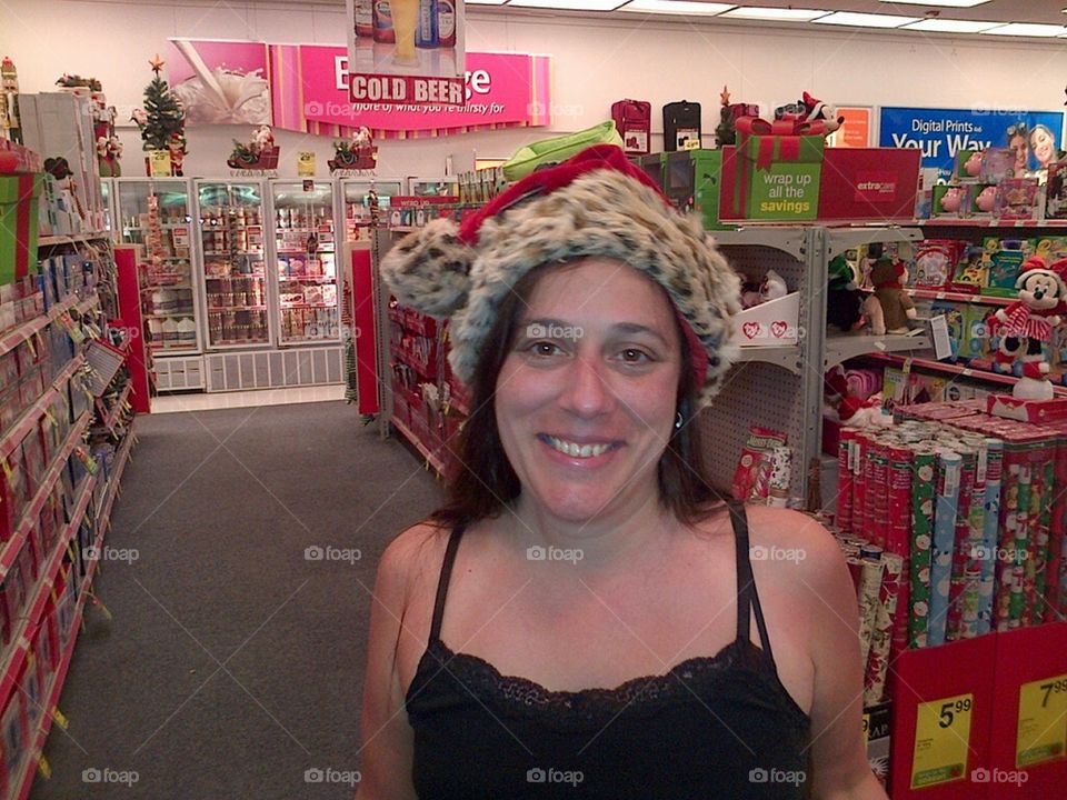 Brunette Girl Smiling Wearing Santa Hat
