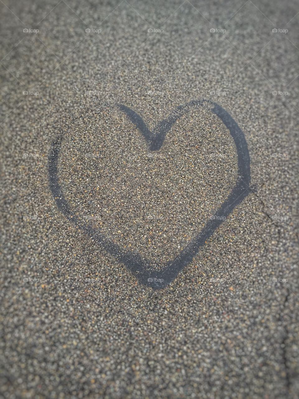 Black heart painted on grey ground