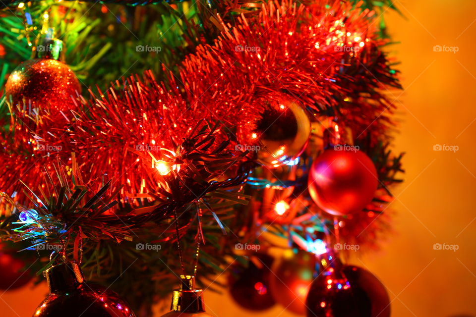 Macro shot of Christmas tree decorations and vivid lights