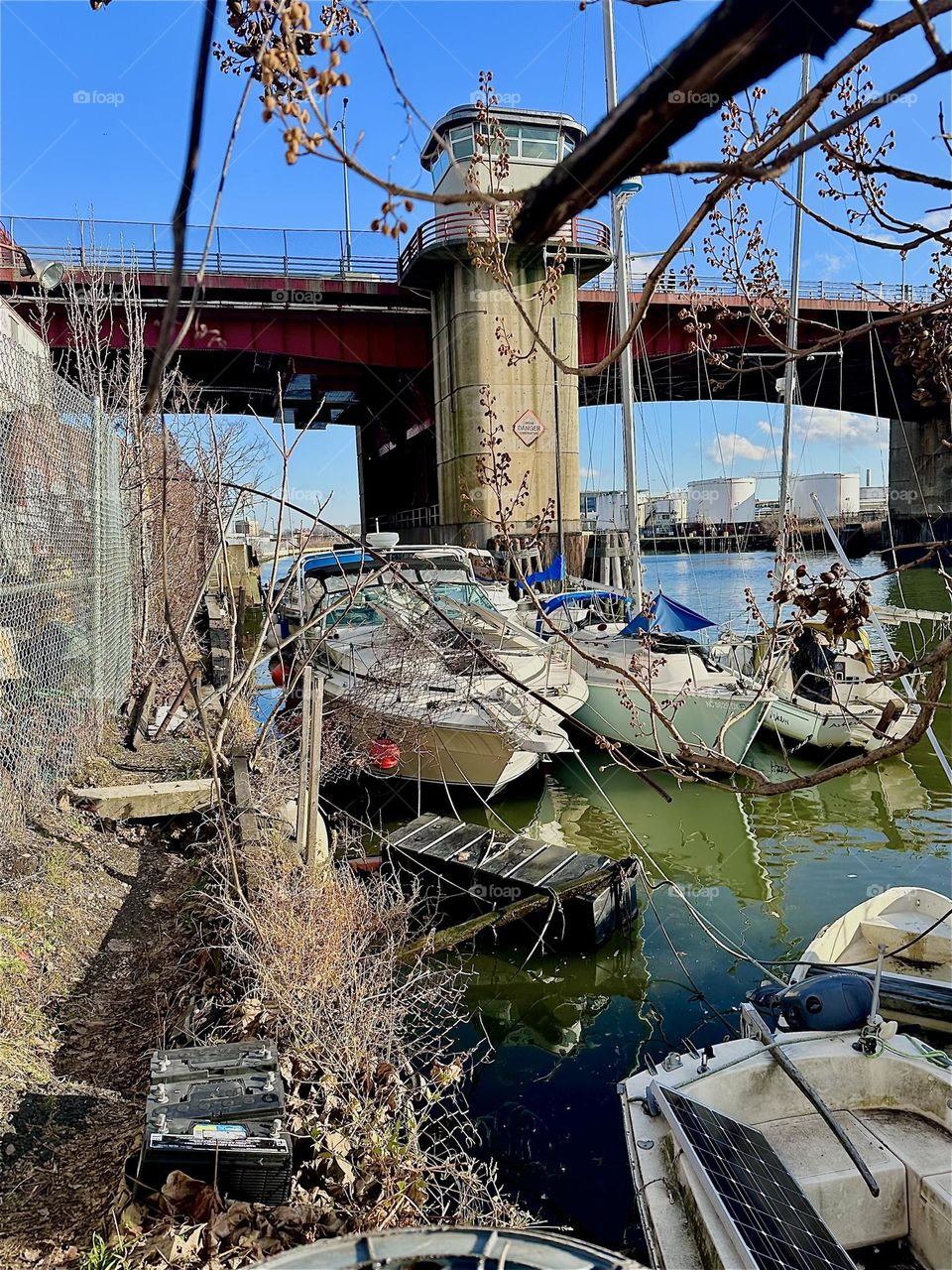 This is picturesque “Newtown Creek” by the “Pulaski Bridge” in LIC, Queens where various boats of different kinds tie to the shore. 2023. Hypnotic Productions