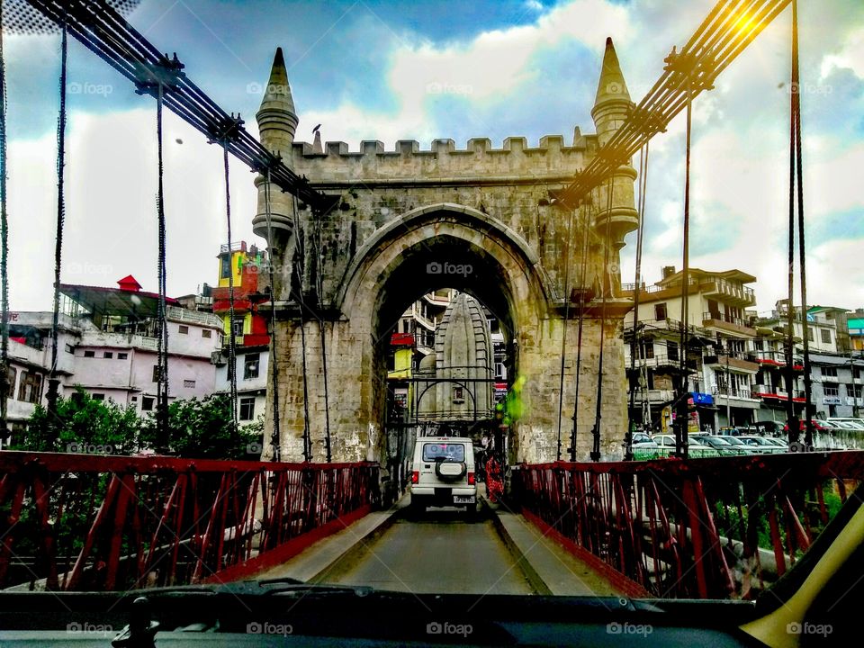 Victoria suspension bridge - Himachal Pradesh
It was built by the Britishers in the 18th century. 
The amazing part of the bridge is that it is only hanging on these thick ropes➰