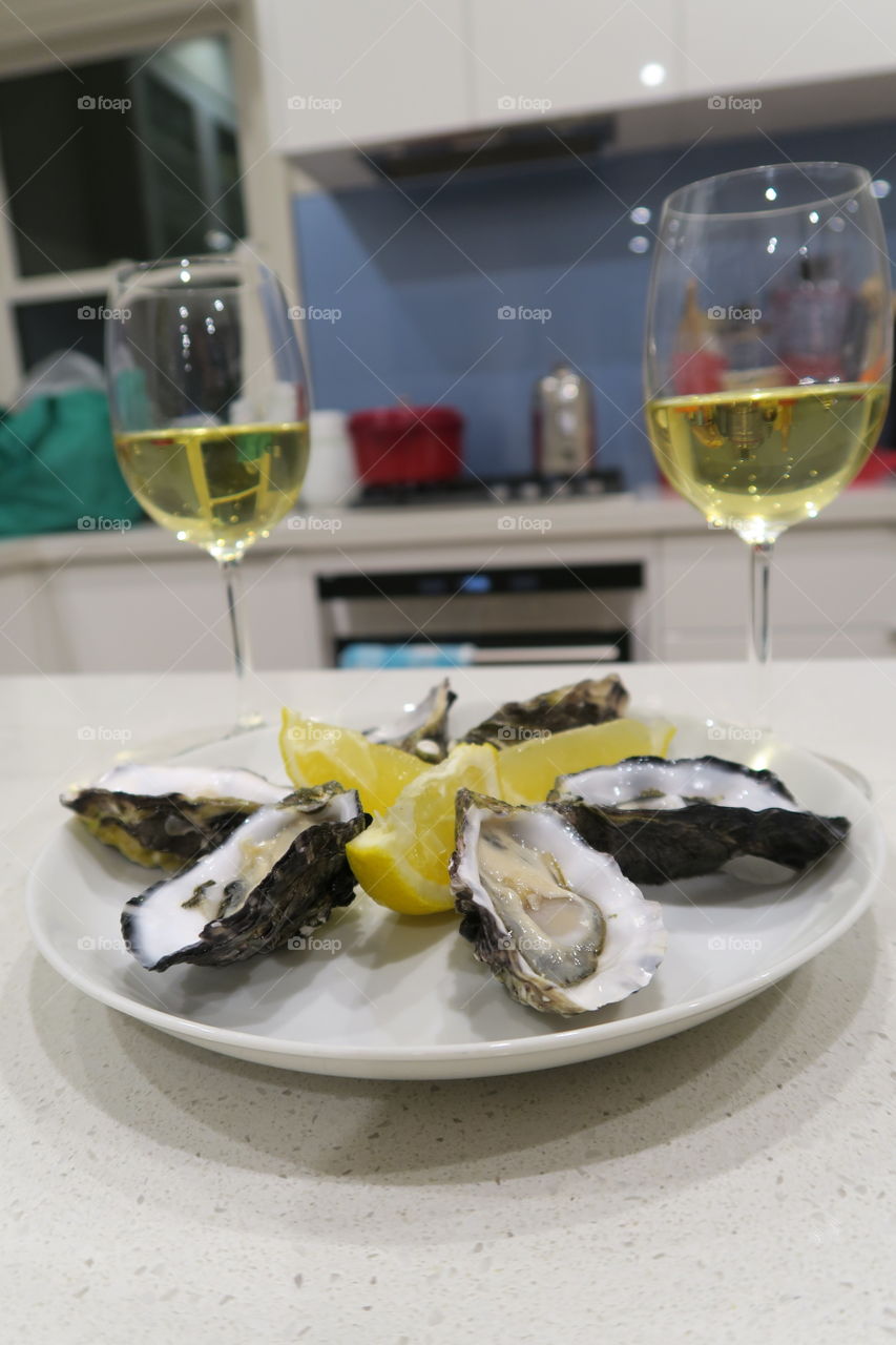 Home cooking, entree, oysters , natural , in shell, lemon, white wine , Riesling, glass, gourmet, delicious