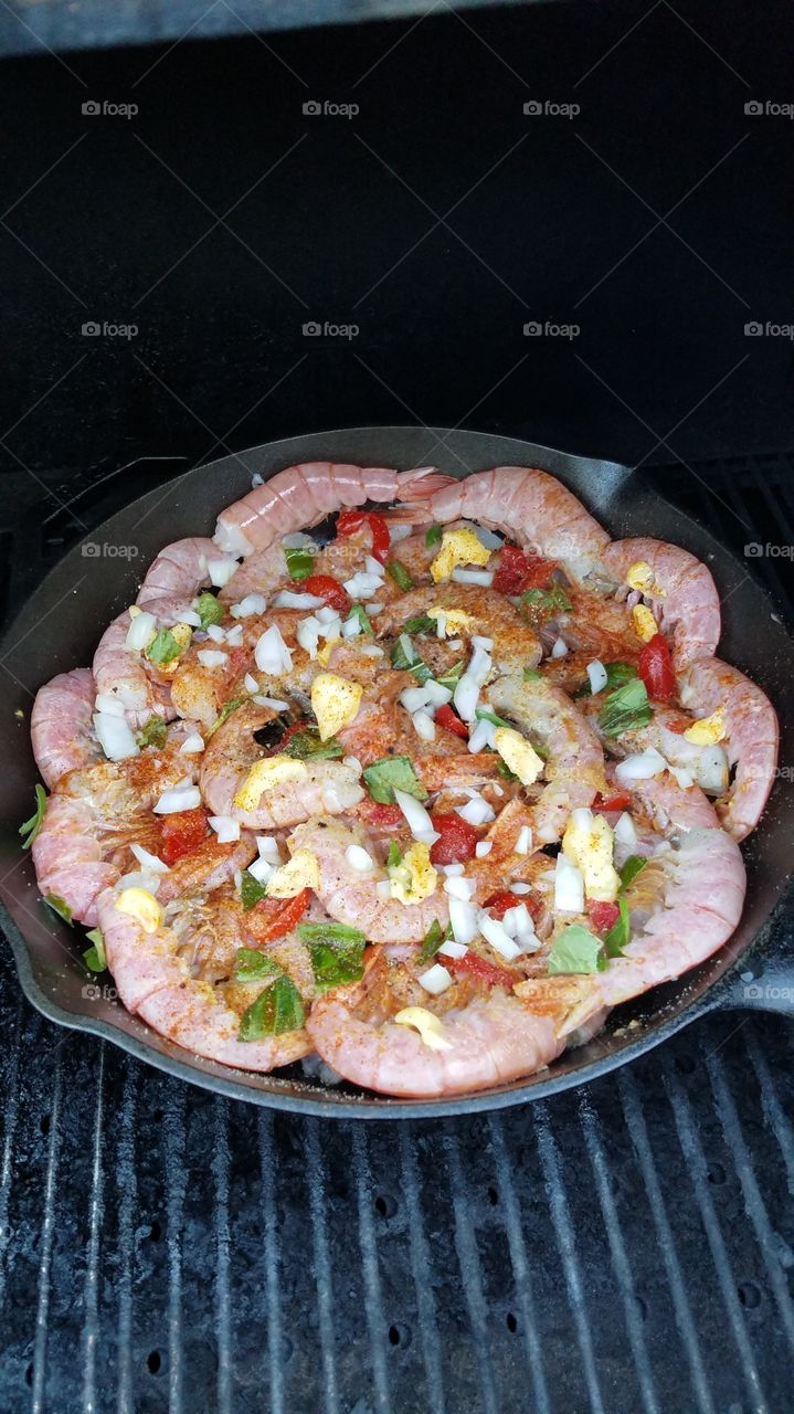 Shrimp in cast iron on grill