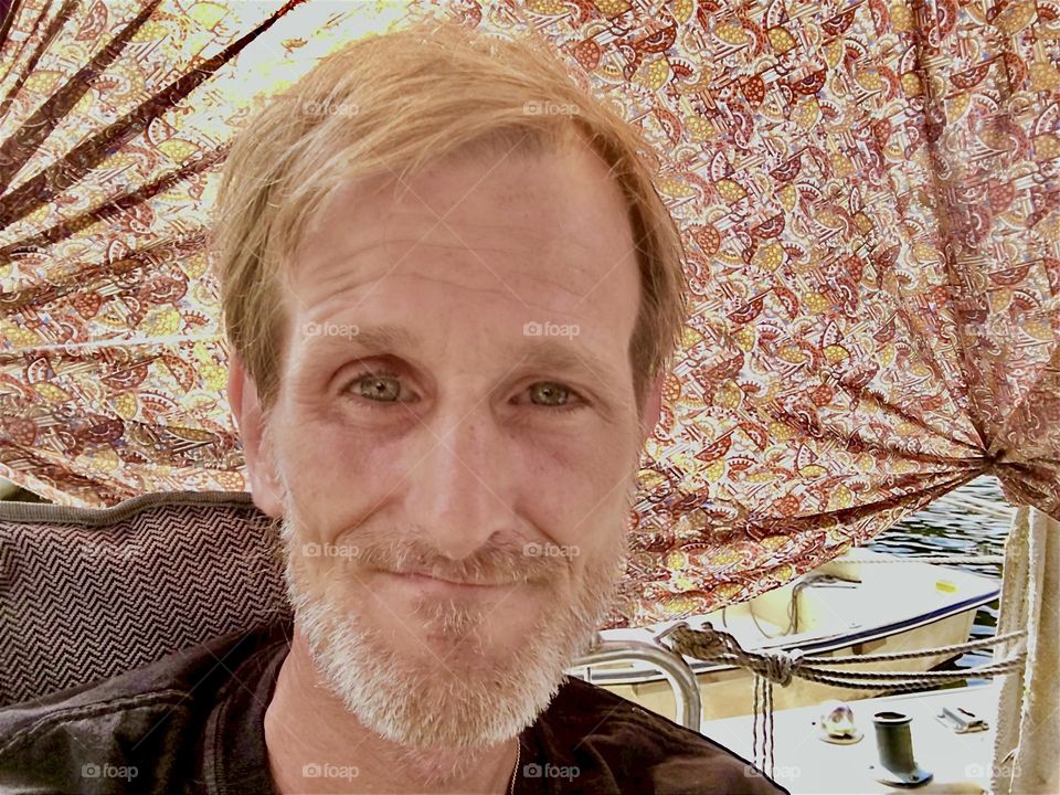 This is my longtime partner and friend “Timothy Trespas” on a beautiful sunny day in 2020 aboard “Salvation”, the “28 foot 1969 Luhrs” cabin cruiser that we both call home. Hypnotic Productions