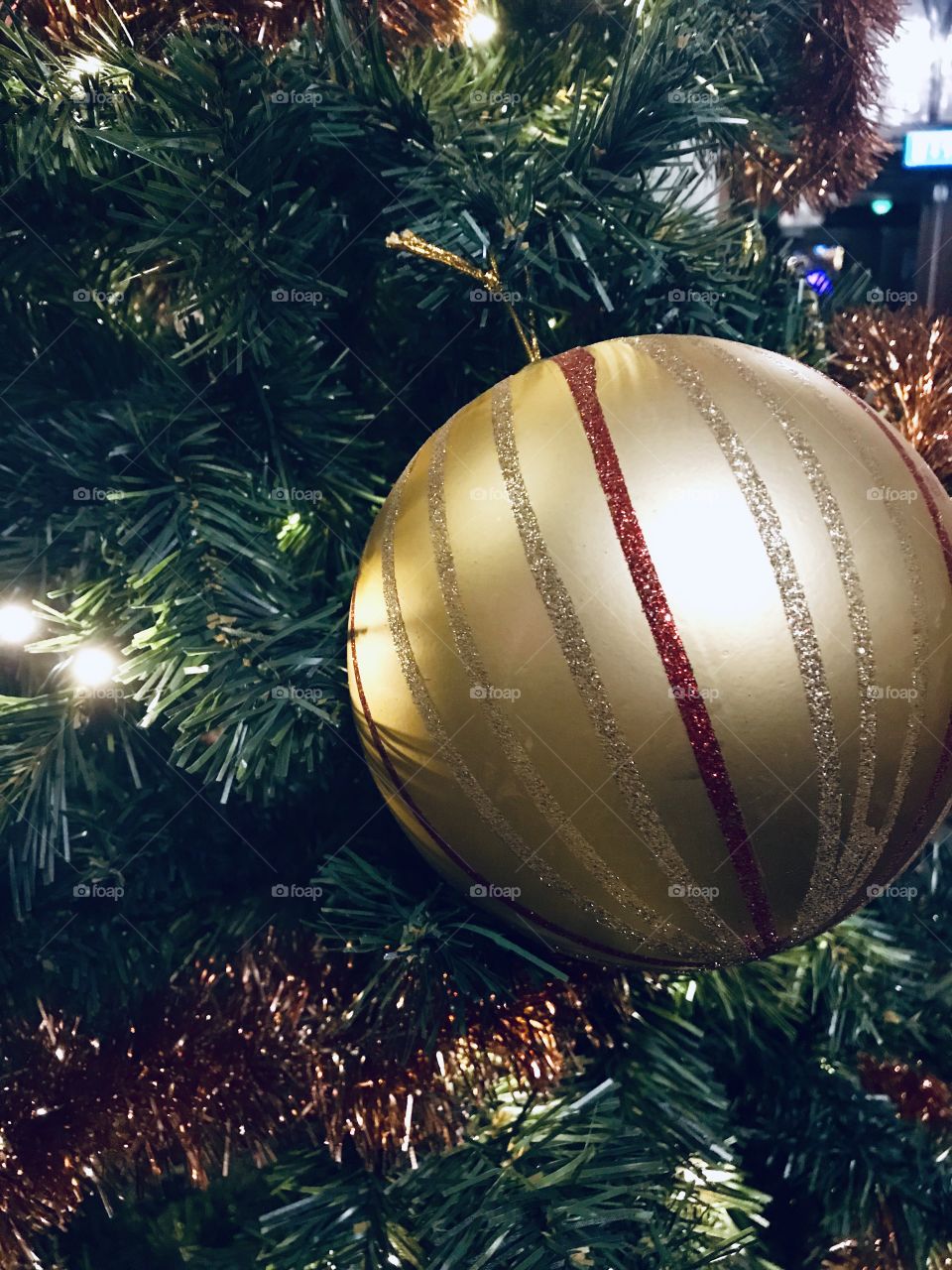 Golden christmas decoration in a christmas tree
