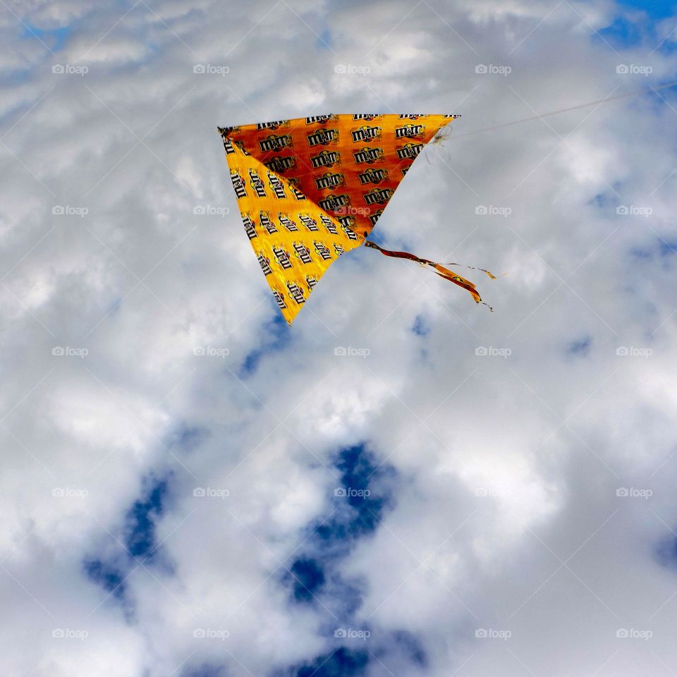 Flying high. Kite flying high at the beach 