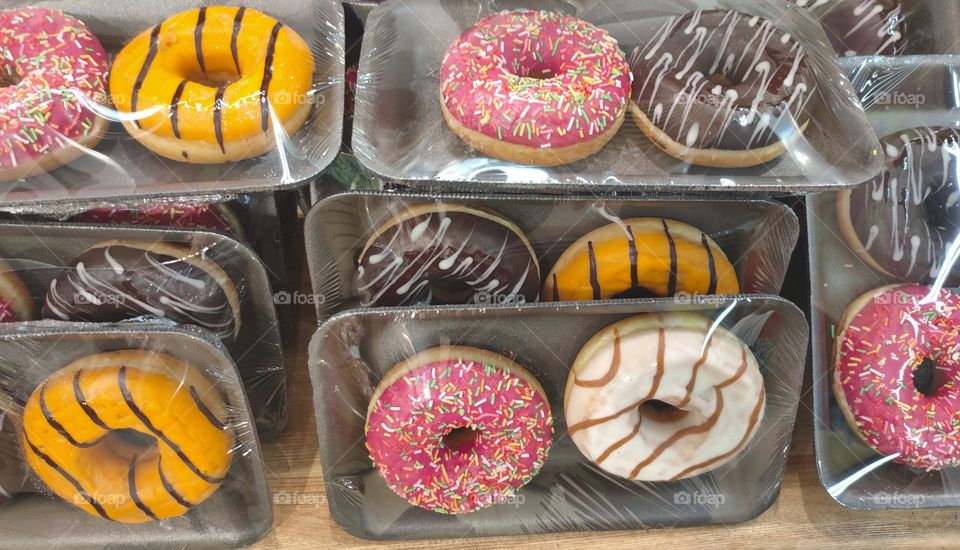 fresh sprinkled multicolored donuts