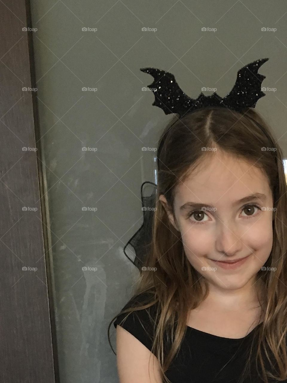 Sweet girl with cut bat headband for Halloween 