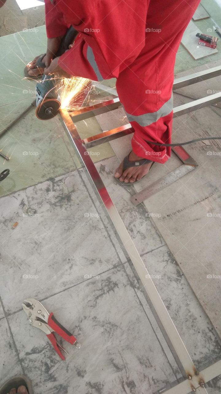 MetalWork, cutting stainless holow for making balcony railing....