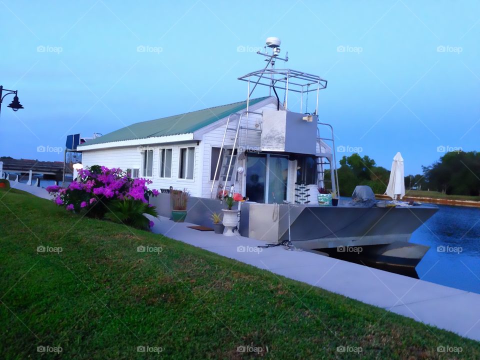 A comfortable house boat on a river ready to move you in style at anytime.