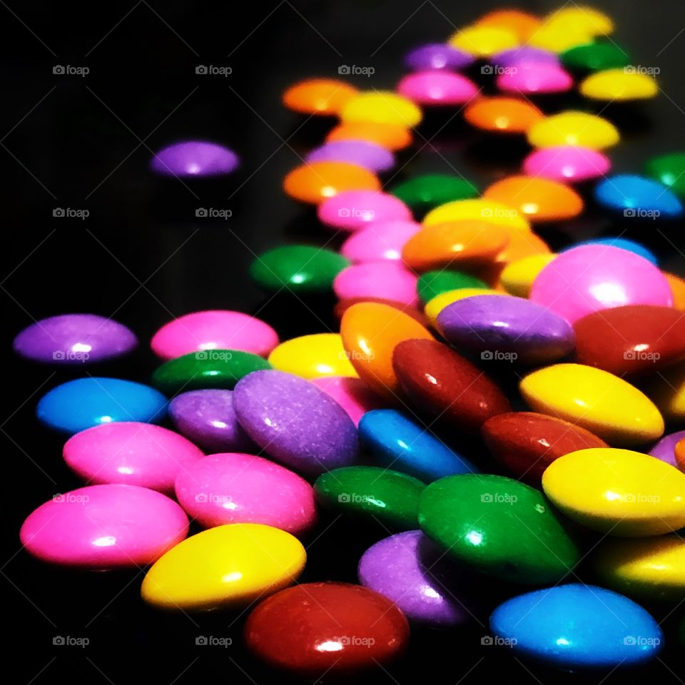 Colorful and delicious! Impossible to eat just one: colorful button-shaped chocolates... 