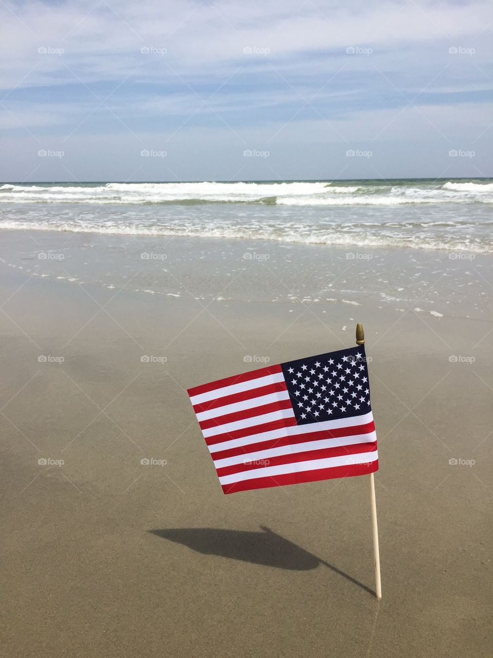 American flag. An American flag flying at the beach