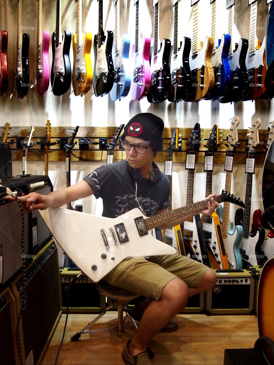 a young musician with an electric guitar