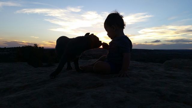 baby boy and his puppy