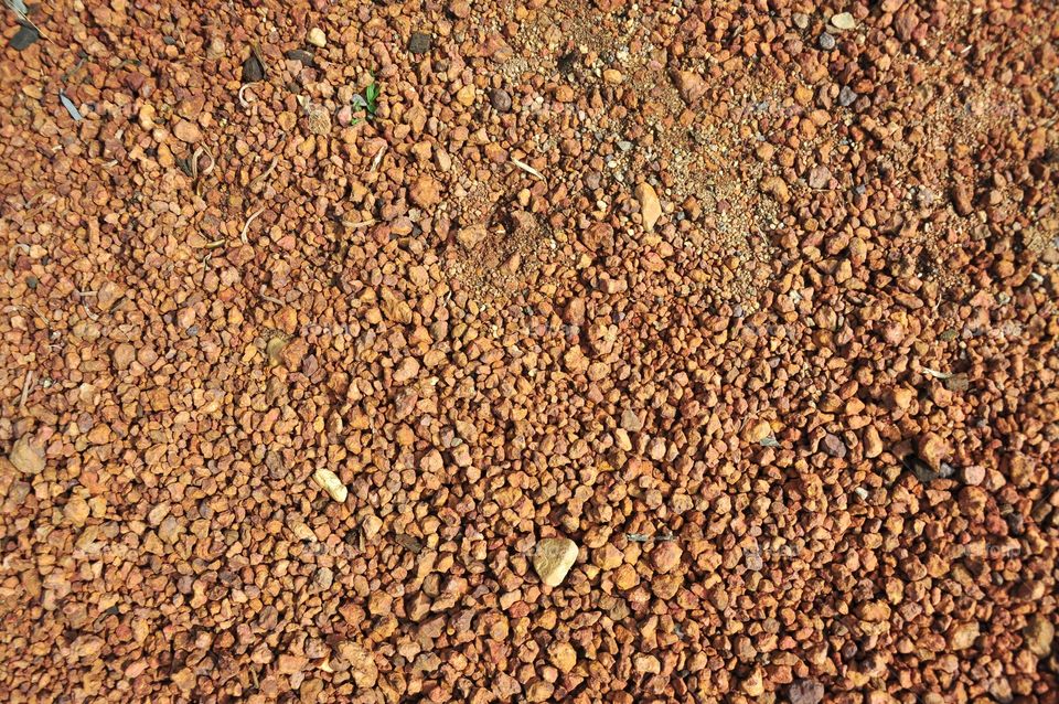 Red laterite gravel texture. Red gravel texture.