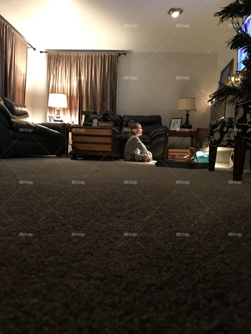 Cute girl sitting in bedroom