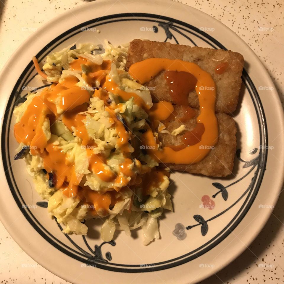 Scrambled egg, coleslaw and hash brown supper at home.
