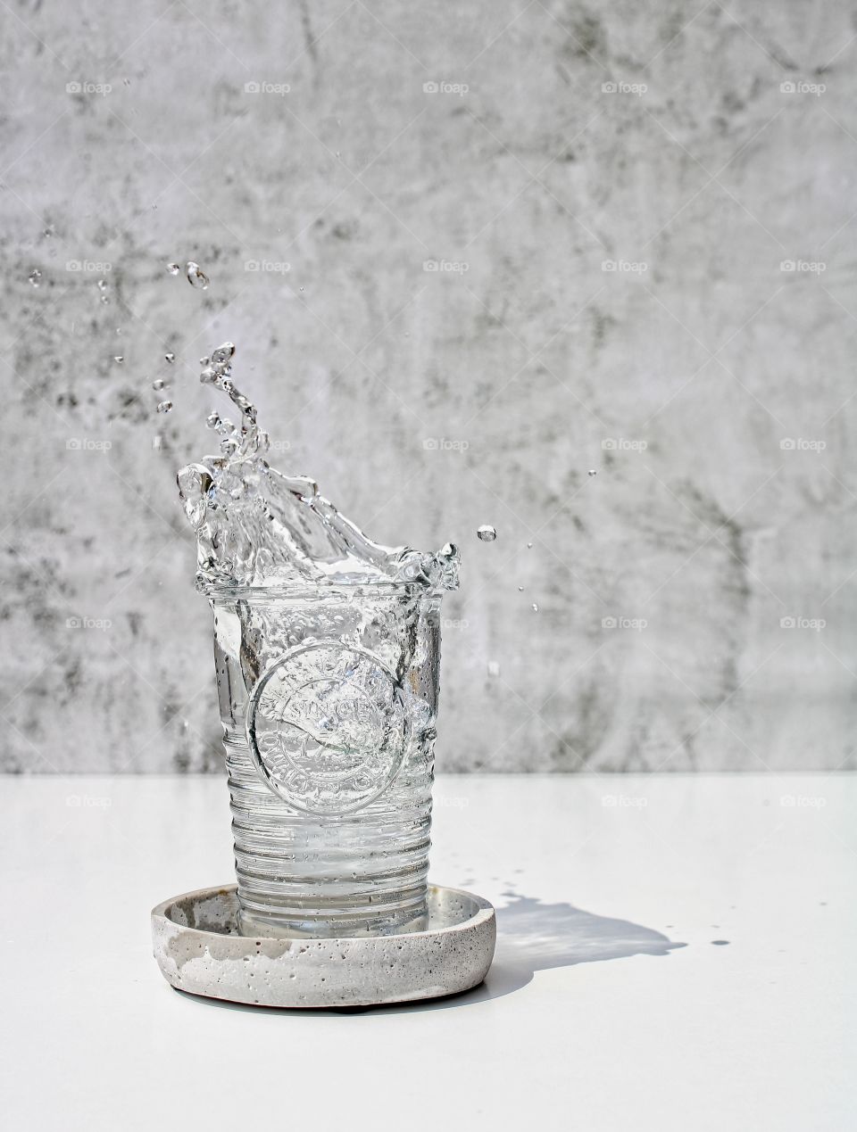 Glass of cold mineral water with splashes
