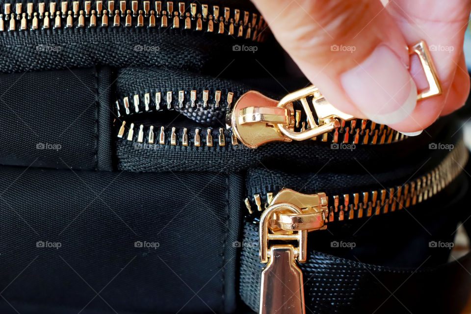 Opening the handbag zipper