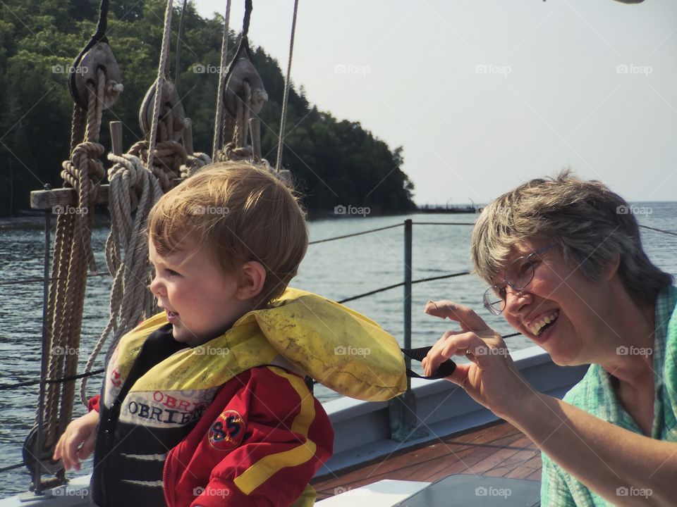 Grandmother and grandson enjoying in boat