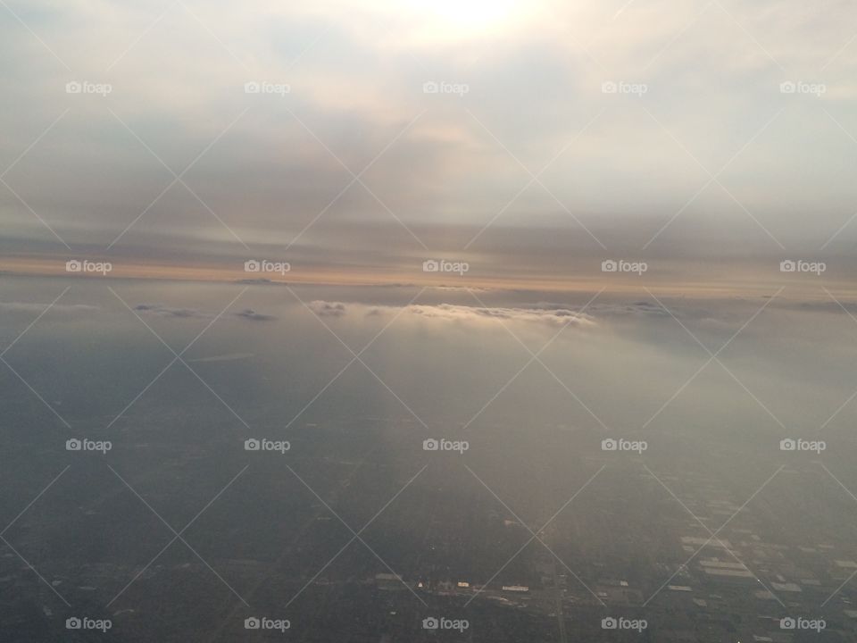 Sun through clouds from aerial view 