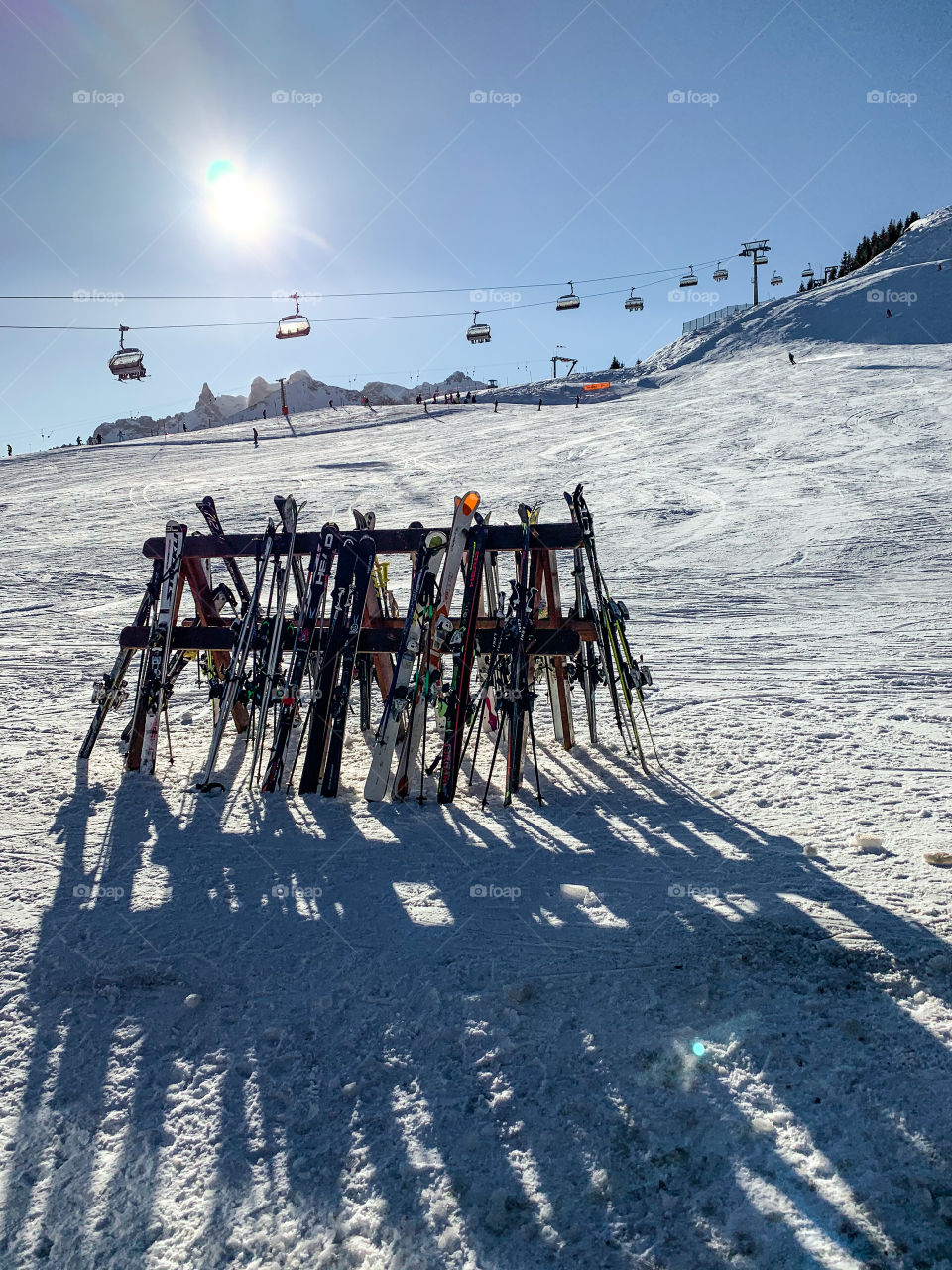 many skis in the mountains and a gondola