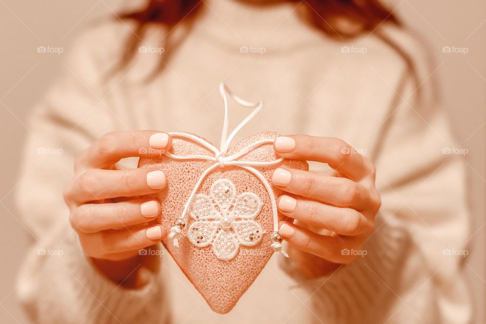 person holding handmade heart shape