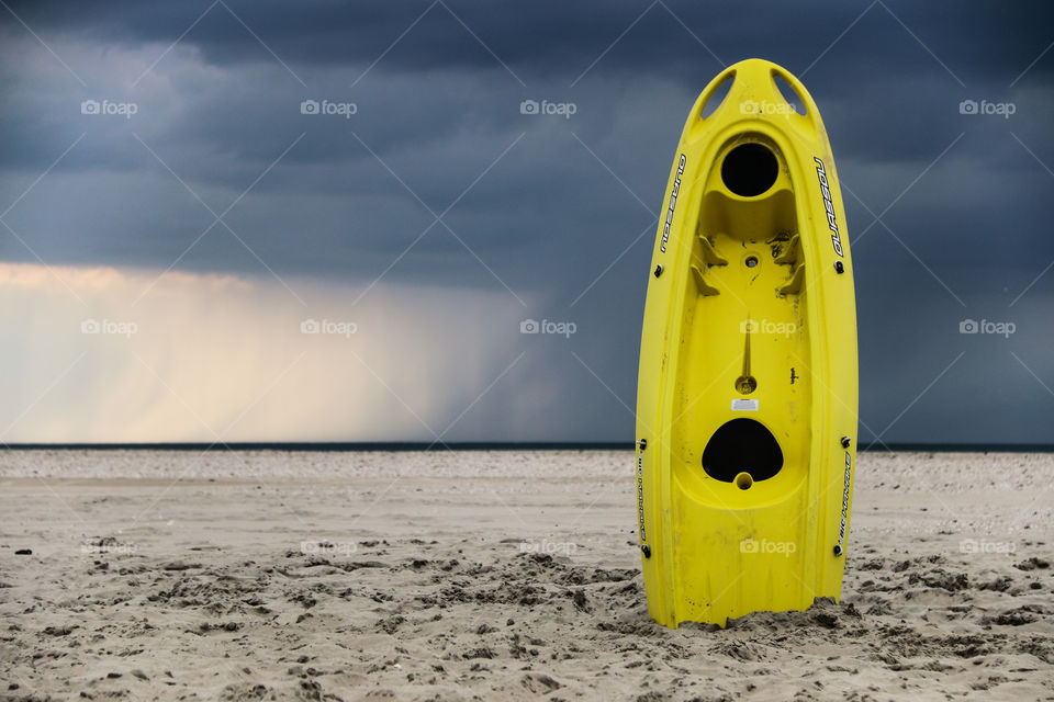 Yellow canoe at the beach